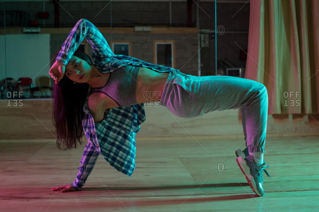 Young female dancer dancing in dance studio