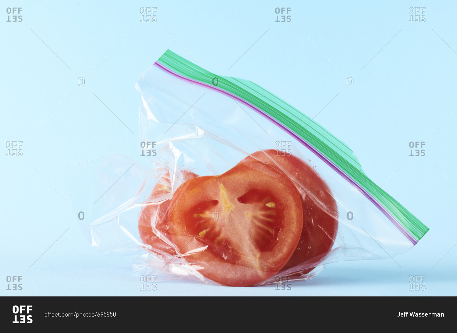 Studio still-life of tomato slices sealed in plastic storage bag