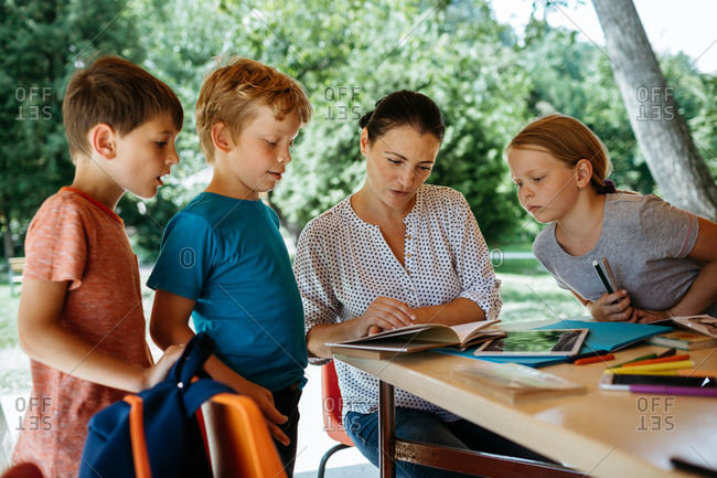 Schoolchildren engaged in listening to a teacher