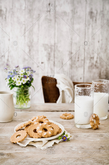 Cookies and milk on wooden table