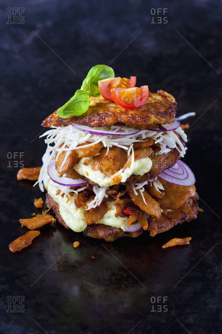 Veggie Burger made of potato fritters-  sweet potatoes- soy meat- remoulade and Barbecue sauce