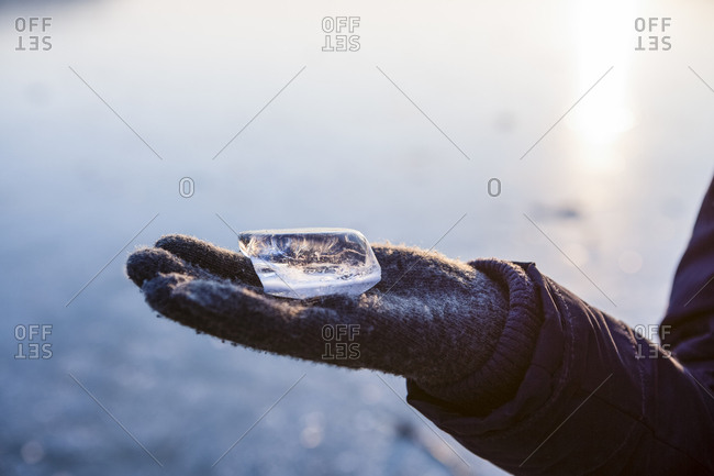 Hand with piece of ice