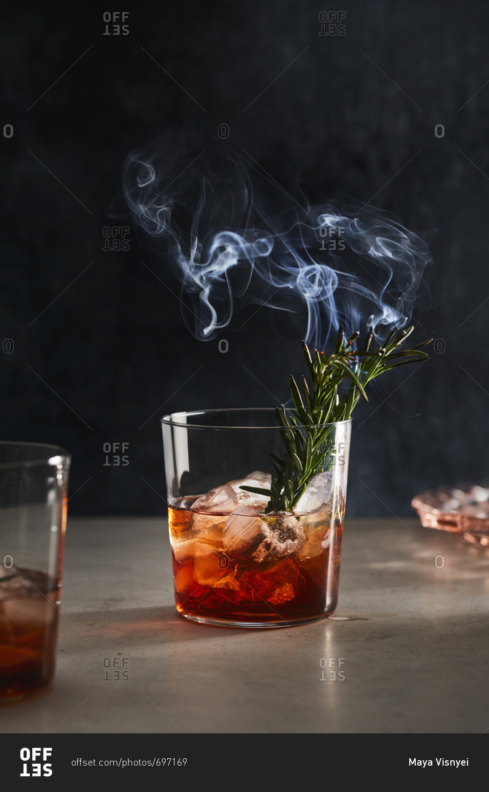 Cocktail with burning rosemary in it stock photo OFFSET