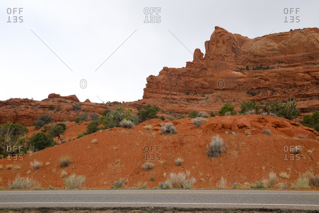 Red Valley, Arizona - April 28, 2018: Roadside angle view of secluded rocky formation stock photo OFFSET