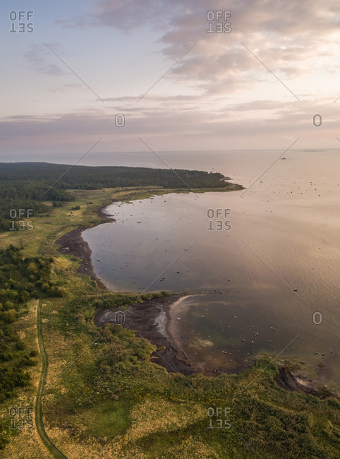 Aerial view of green coastline on the island of Vormsi in Estonia at sunset