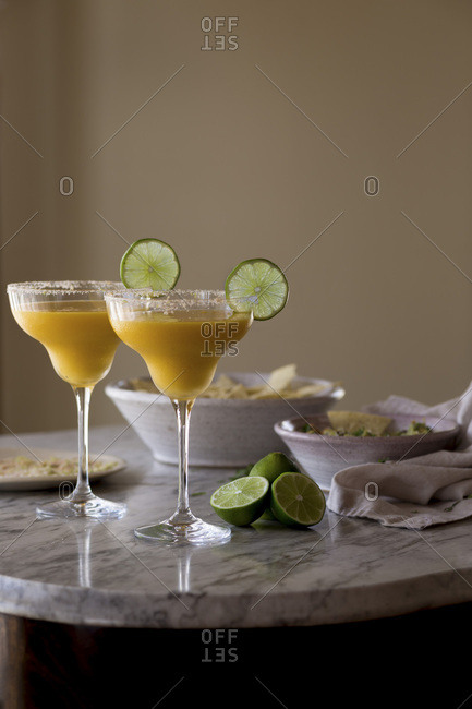 Mango Margarita with dips on a table
