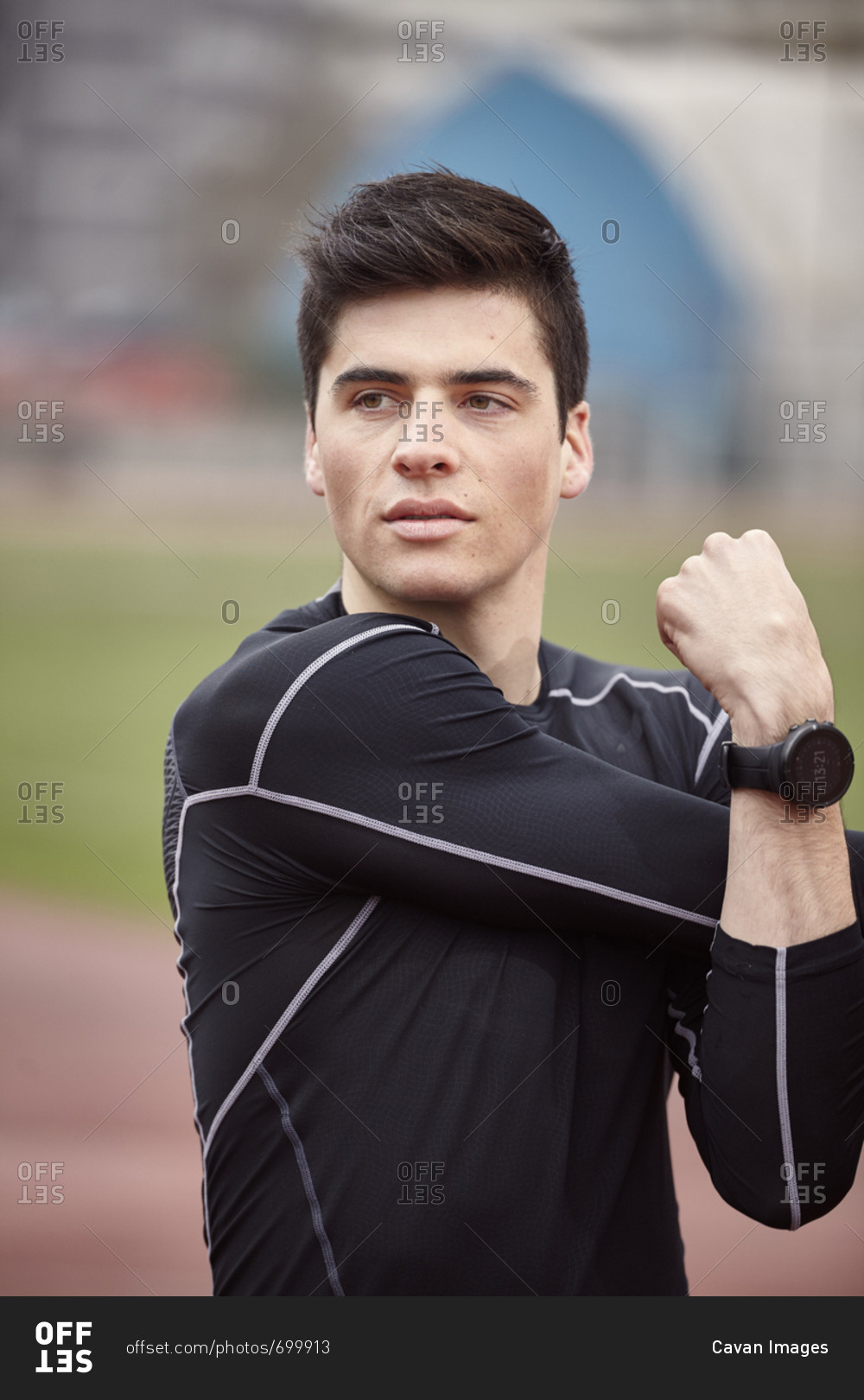 Male athlete exercising on sports track