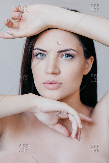 Portrait of beautiful brunette woman with blue eyes and fresh skin