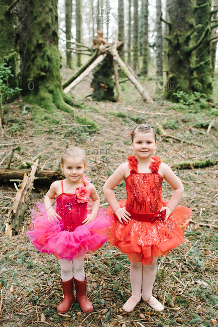 Little girls in ballerina outfits in the woods