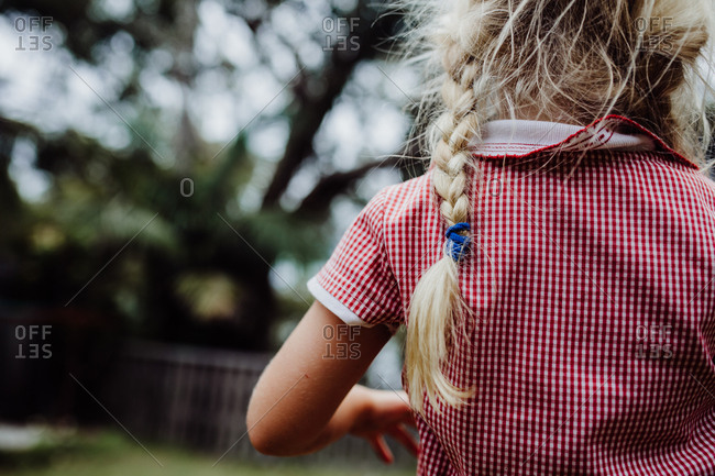Back view of a girl with messy hair
