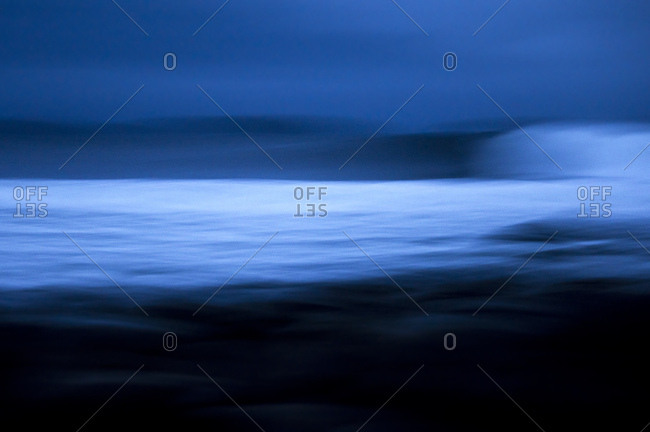 Abstract image of wave breaking on dark and overcast day