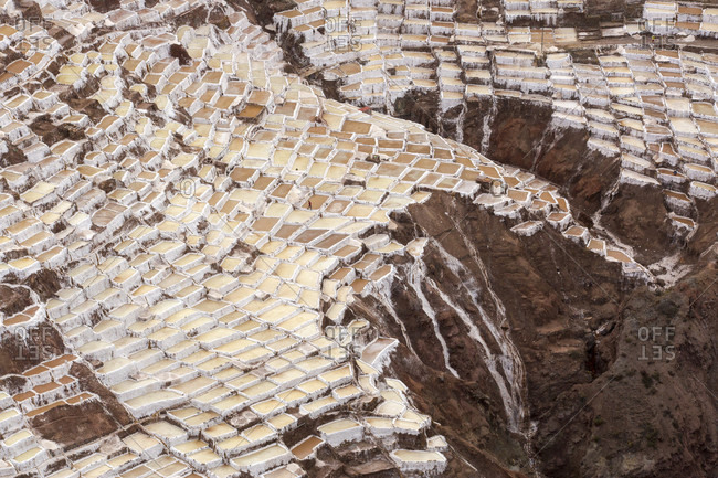 Aerial view of salt pans built on hillside, Maras, Cusco Region, Peru