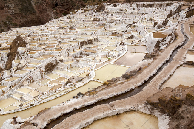 Salt pans built on hillside, Maras, Cusco Region, Peru