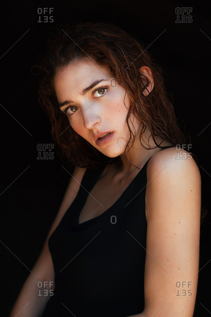 Alluring topless model looking at camera