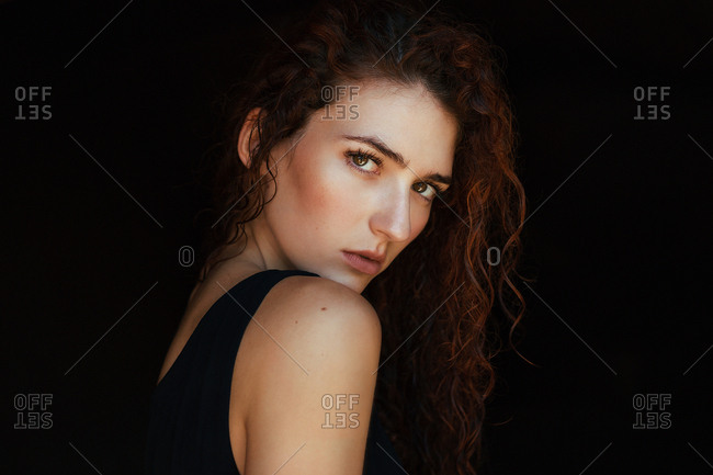 Alluring topless model looking at camera