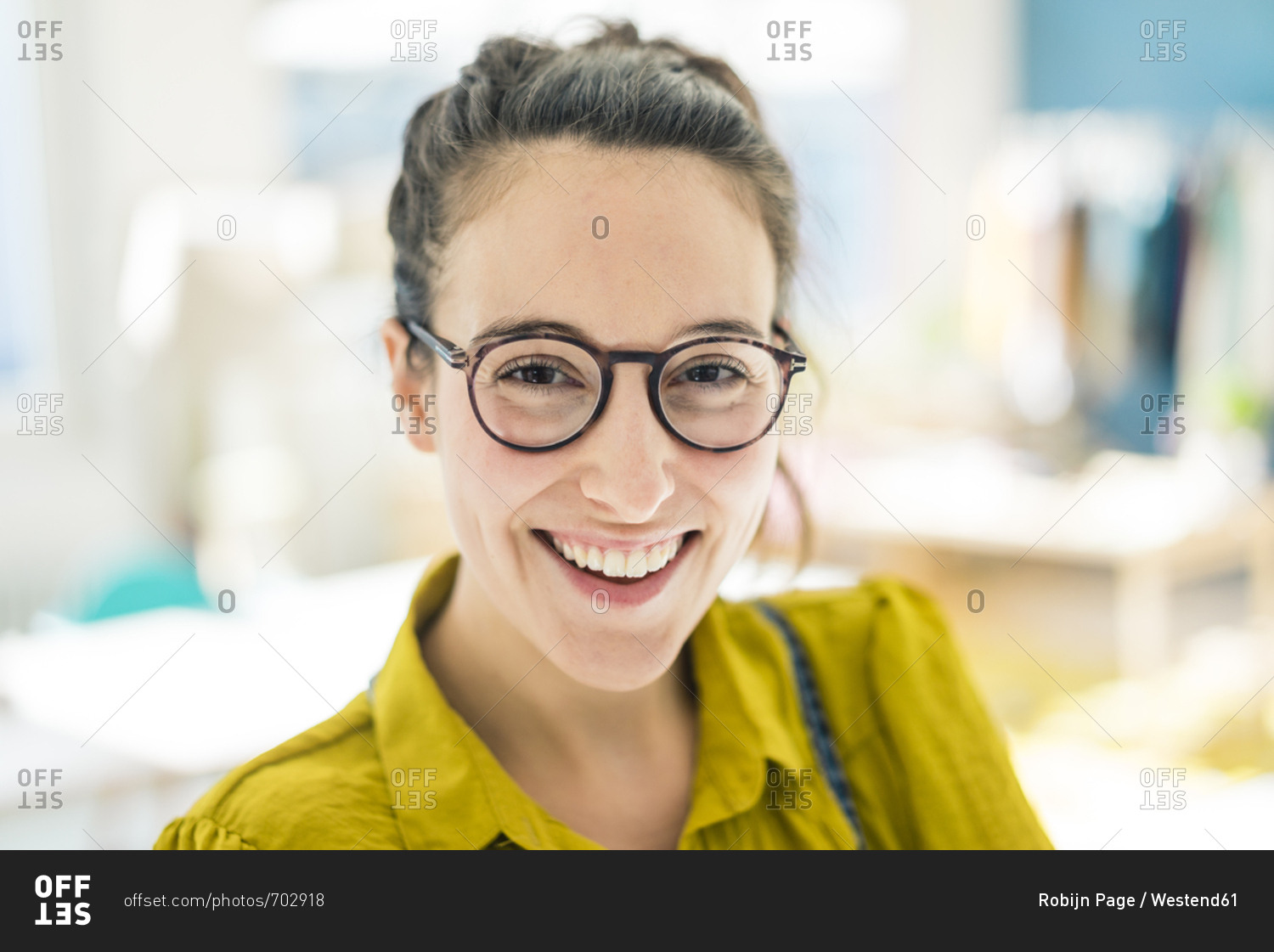 Portrait of happy young woman wearing glasses
