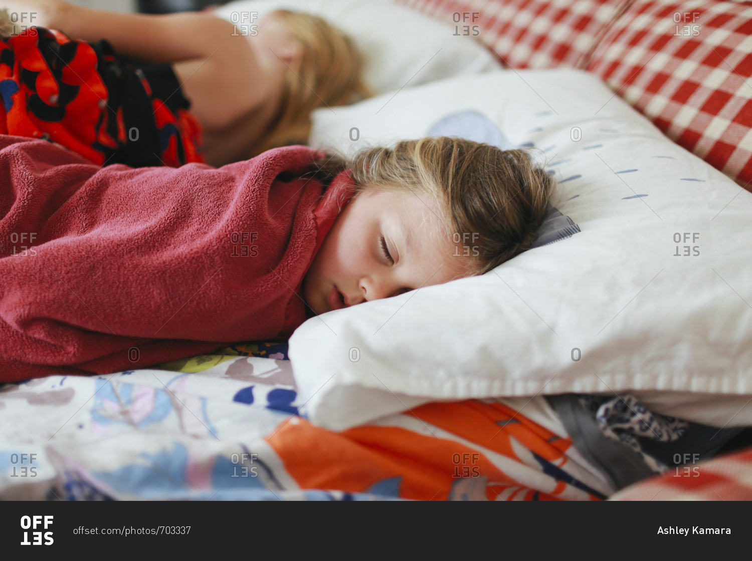Girl wrapped in a blanket sleeping stock photo OFFSET