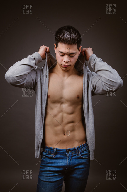 Athletic male fitness model poses with muscular body, focused outdoor.  Regular sport exercises for an active lifestyle. 24685767 Stock Photo at  Vecteezy
