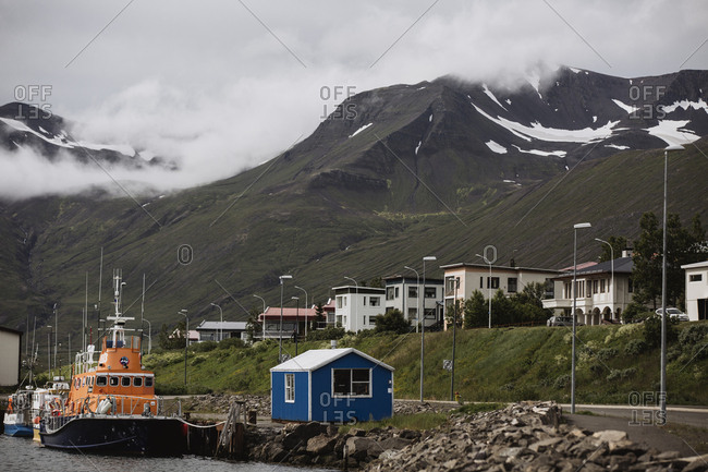 A search and rescue boat at its mooring in the harbor at in the small fishing village of Siglufjorour, Iceland