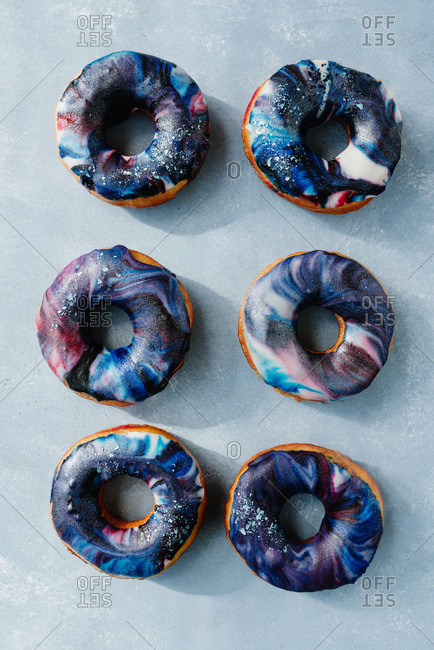Overhead shot of donuts with galactic sugar glaze
