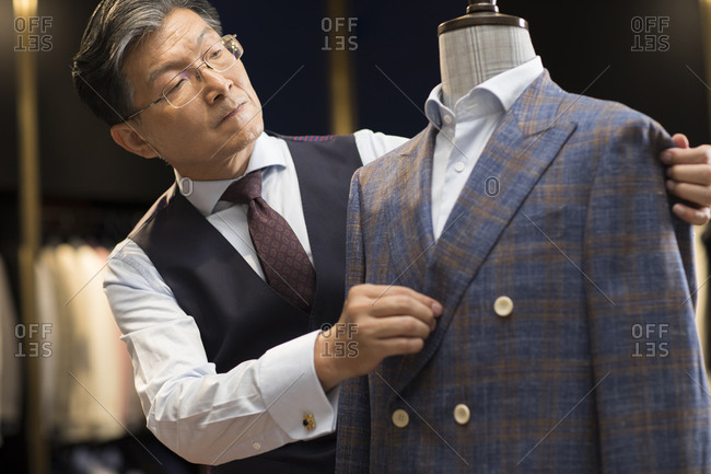 Confident Chinese fashion designer working