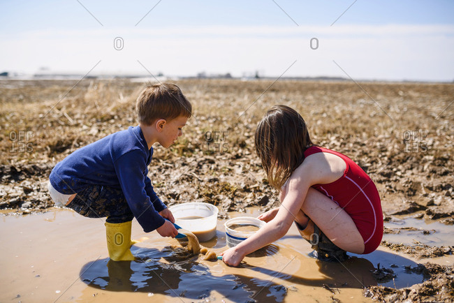 kids playing in the mud
