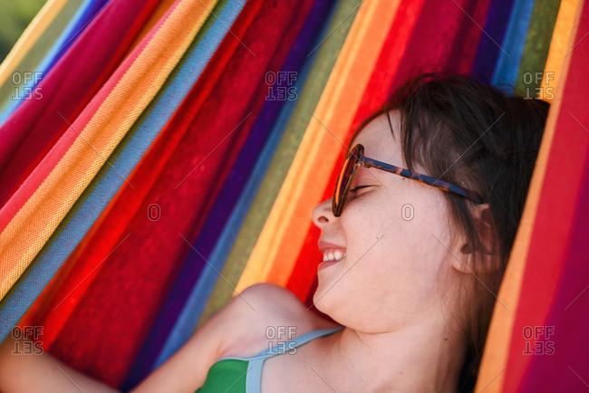 Brunette girl smiling in hammock