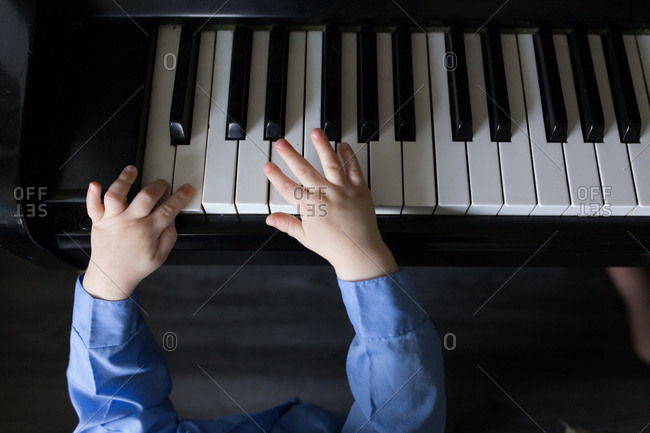 Baby's hands on a piano