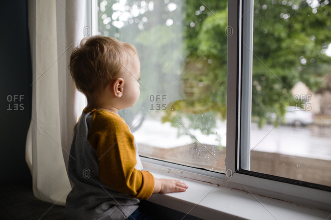 child looking out a window