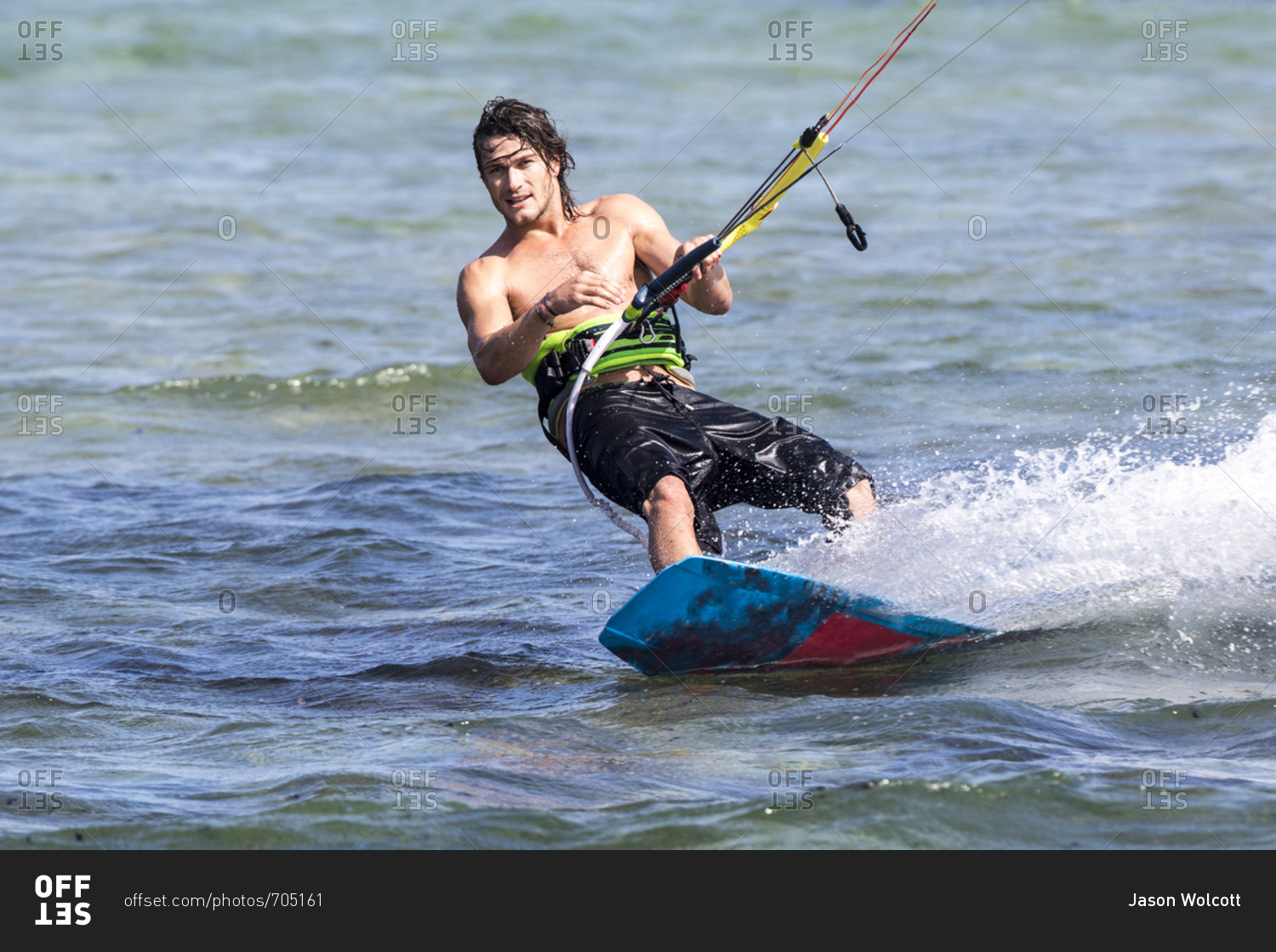 Kiteboarder riding the waves