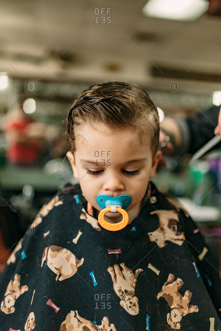 Portrait Of Young Boy S First Haircut At The Barbershop Stock