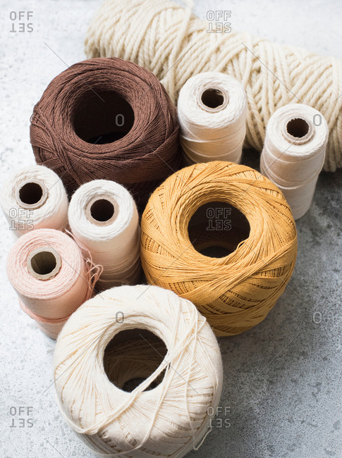 Still life with spools of yarn and string, overhead view