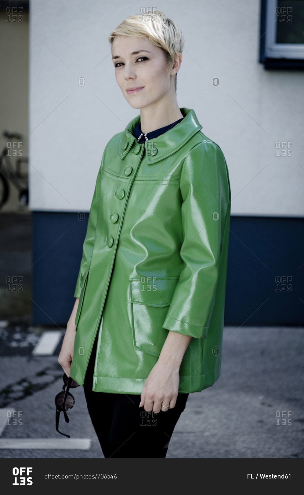 Portrait of woman wearing green vintage leather jacket