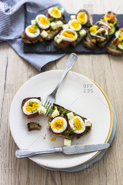 Vegetarian breakfast with bread- eggs and tomato slices and cucumber slices