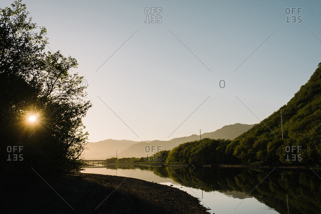 Sun setting over an Alaskan river