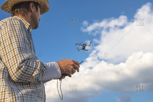 Farmer piloting drone