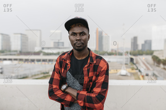 Portrait of handsome black man with cap wearing casual clothing