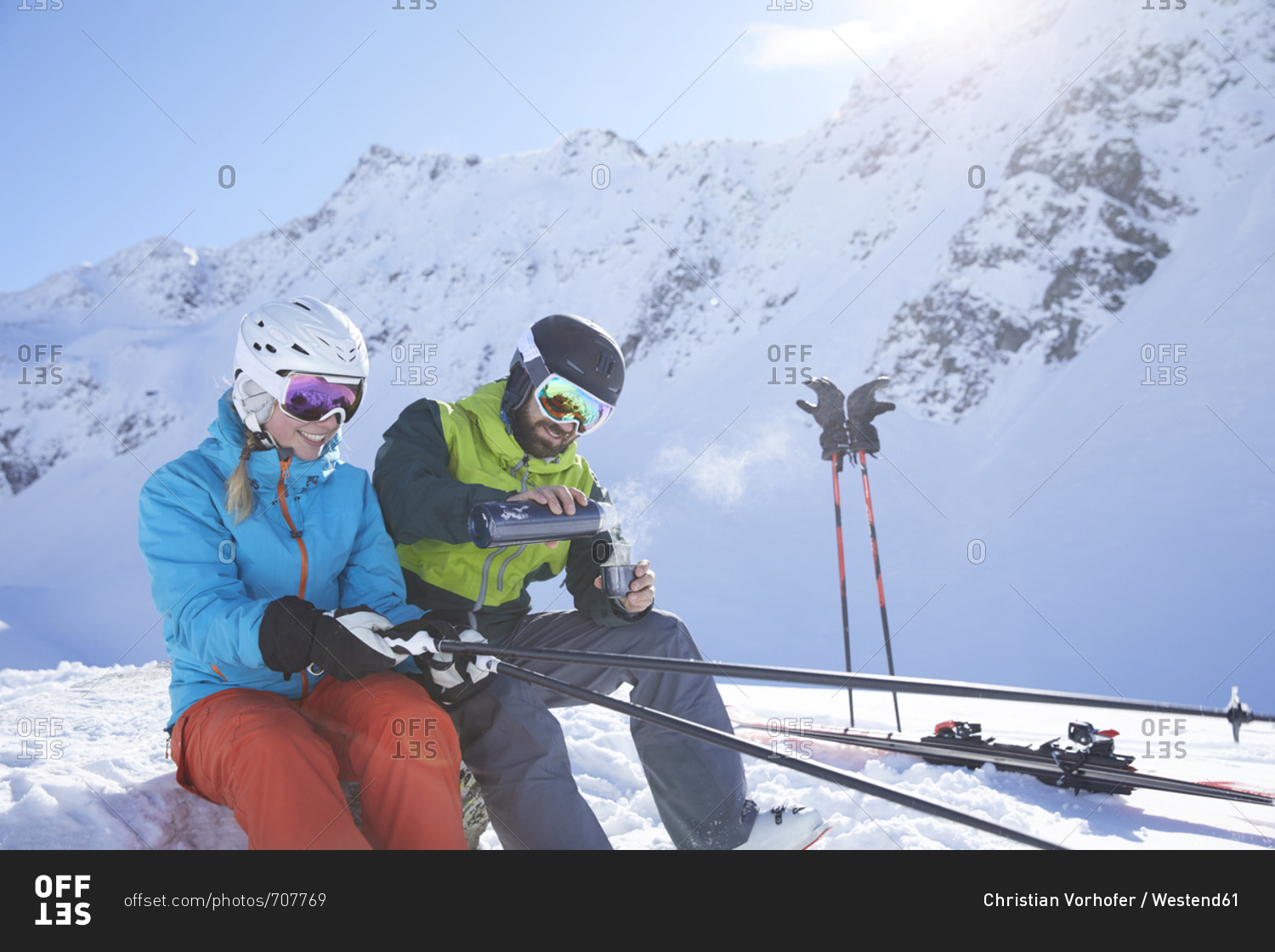 Austria- Tyrol- Kuehtai- two skiers in winter landscape having a break