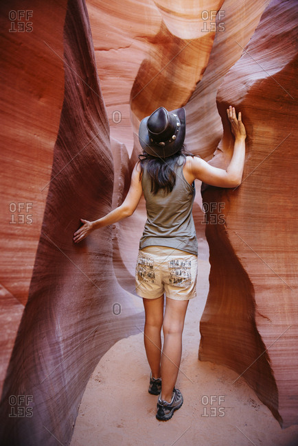 USA- Arizona- Woman with cowboy hat visiting Antelope Canyon
