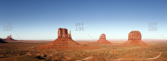 Monument Valley, USA - April 26, 2010. Overlooking the famous Monument Valley on the Arizona / Utah border. Here the West and East Mitten Buttes with the Merrick Butte (right).