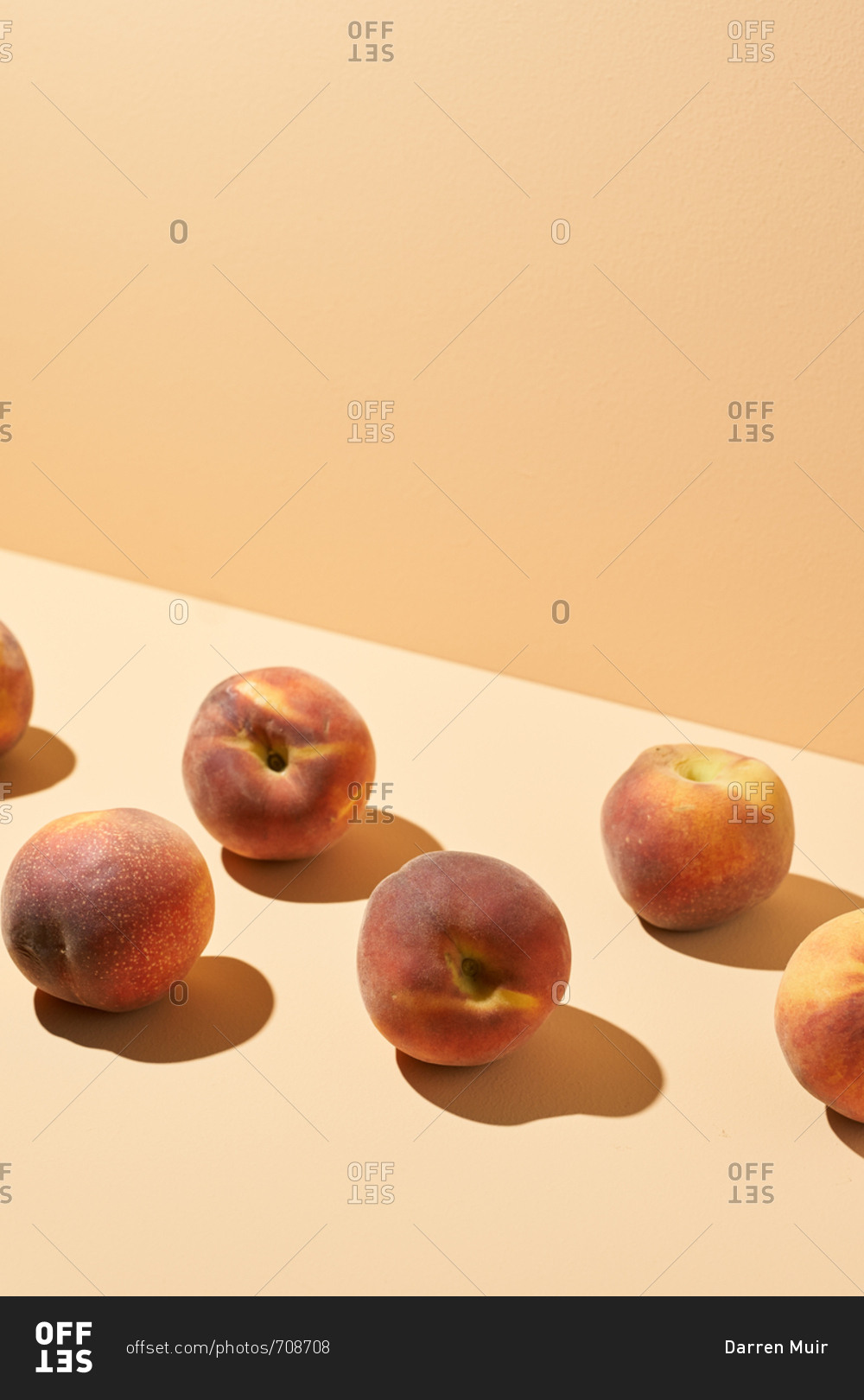 Ripe peaches photographed on peach background in studio