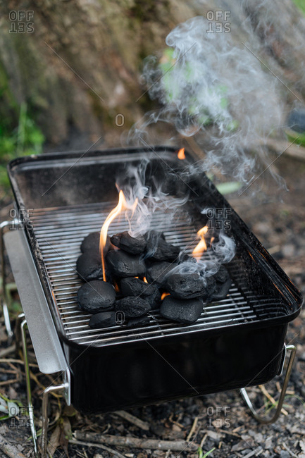 Charcoal burning on a small grill
