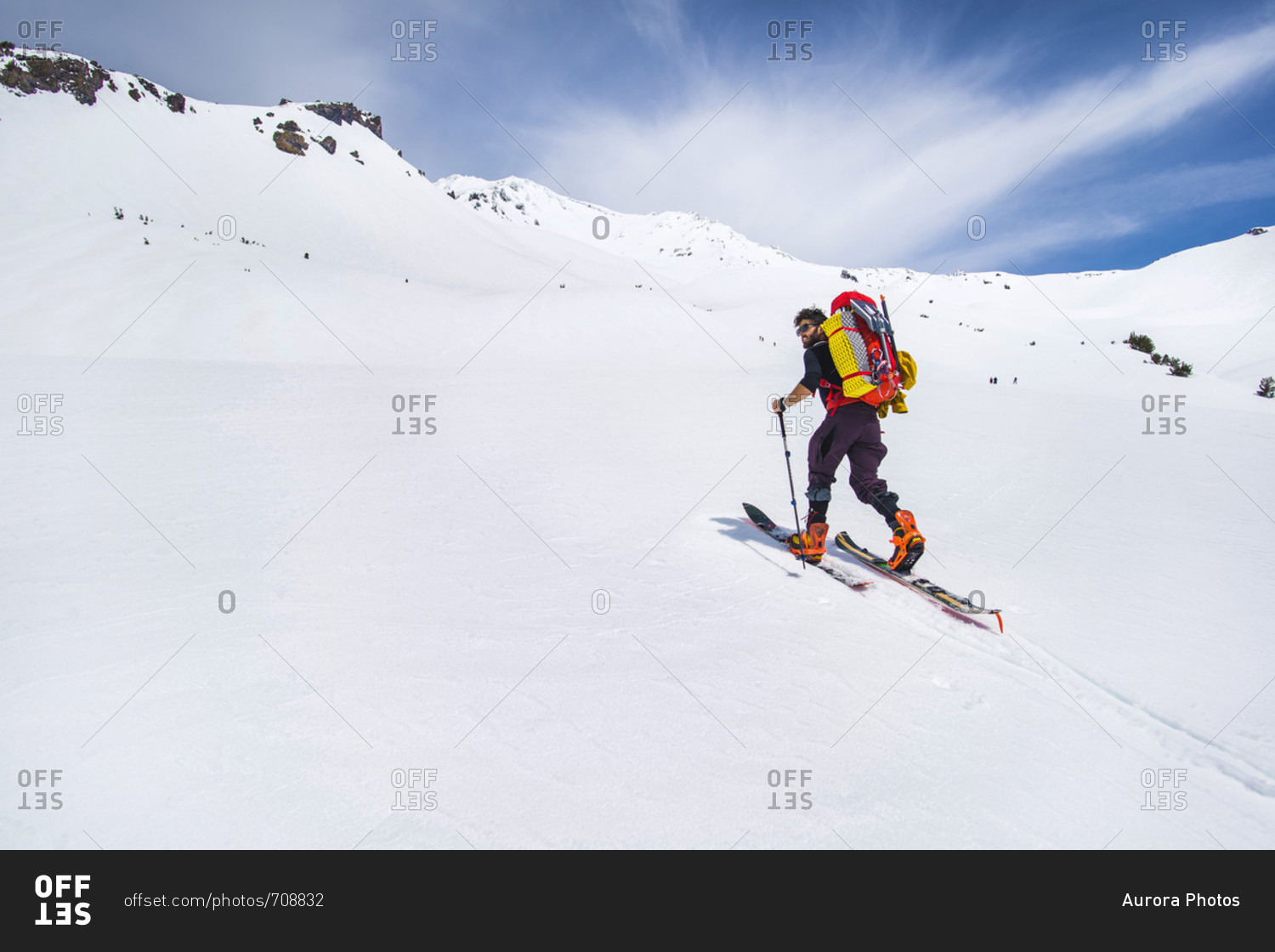 Man cross country skiing towards Mt Shasta, California, USA