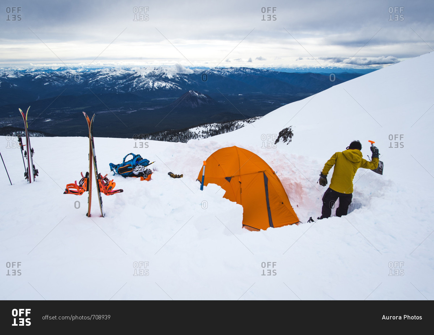 Man camping with tent in winter at Mt Shasta, California, USA