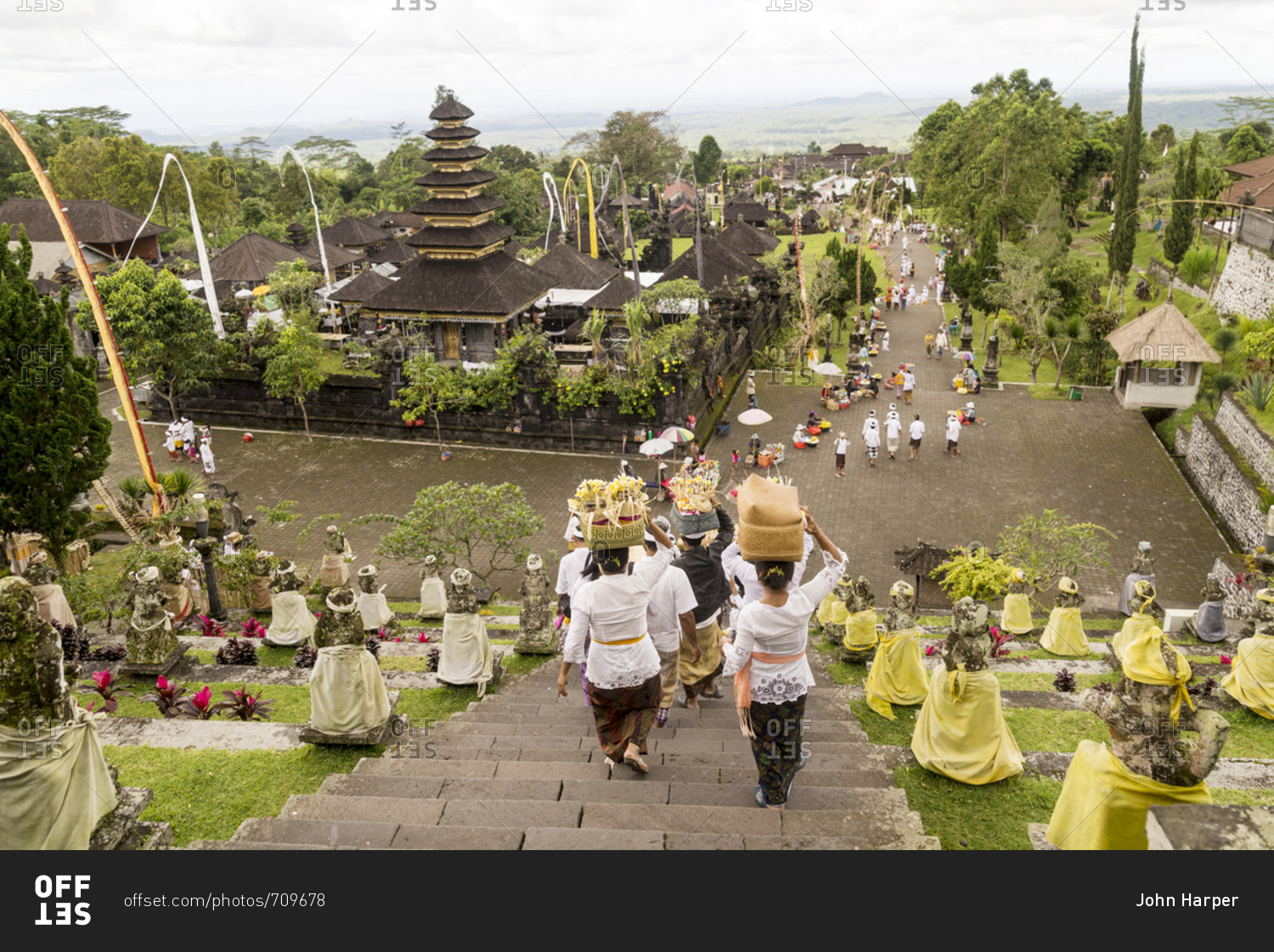 Looking down on procession of worshippers carrying offerings as they descend the stairs of Besakih Temple in Bali, Indonesia