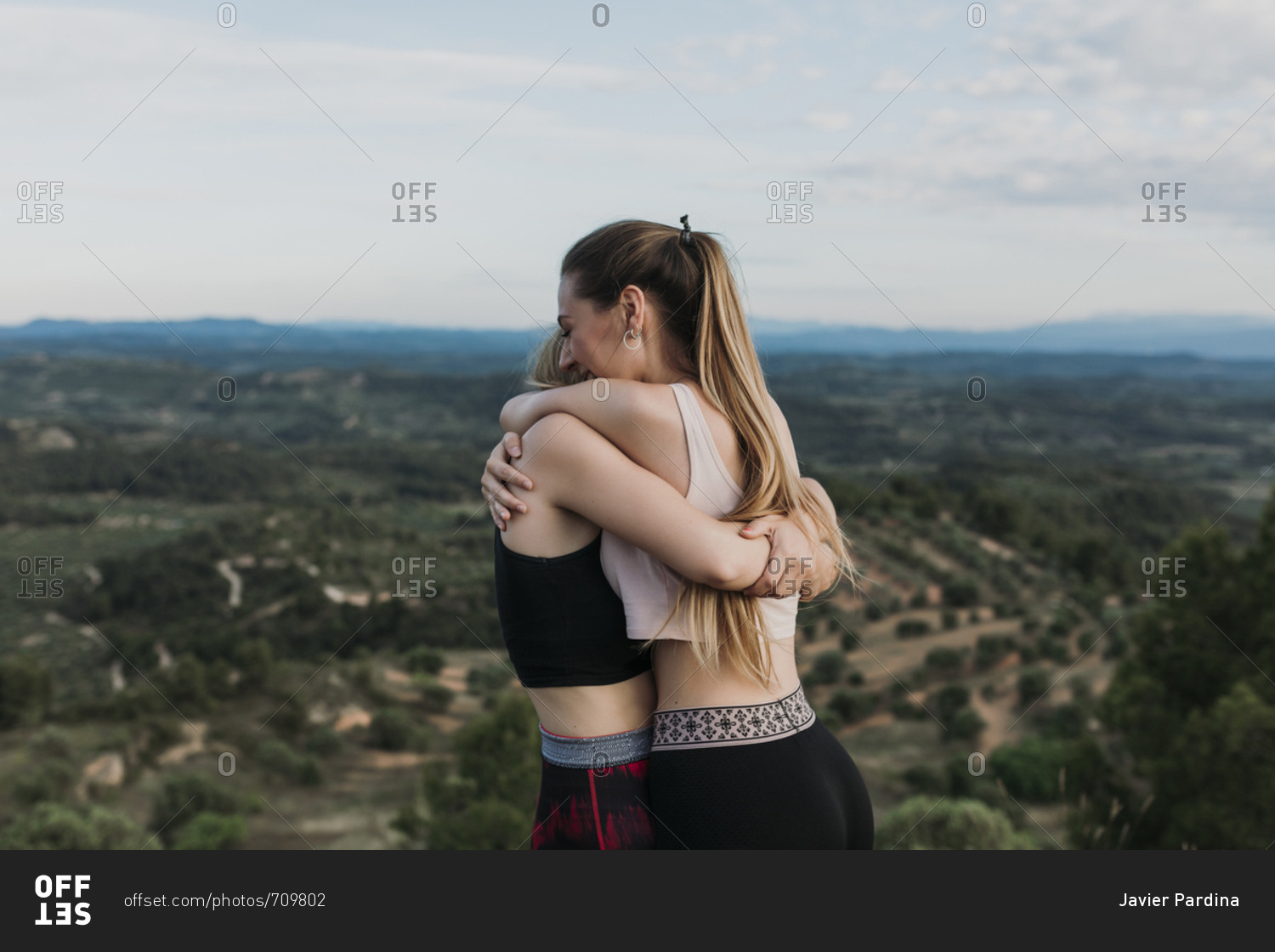 Young women hugging during workout