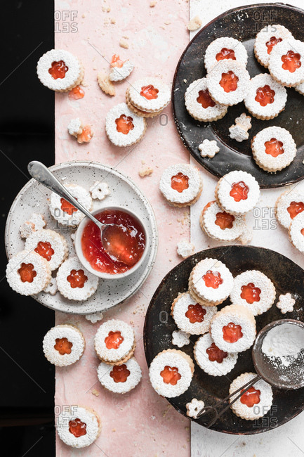 Grapefruit jam filled linzer cookies dusted with powdered sugar.