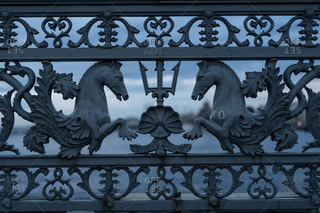 Sculpted horses on ornate gate details