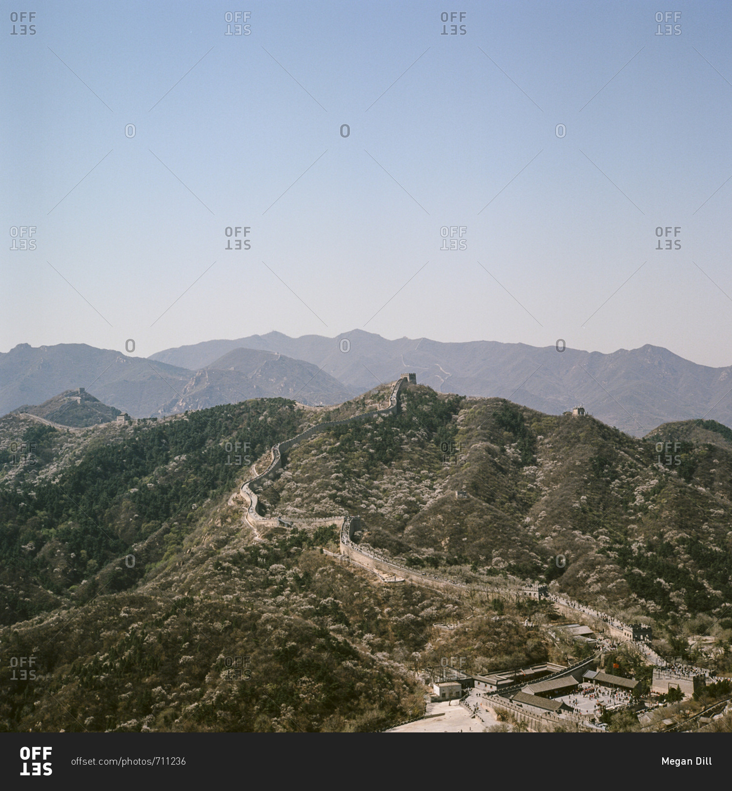 Panoramic view of great wall of China snaking over hills