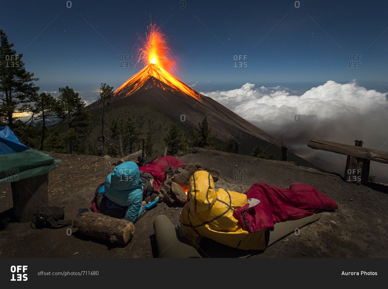 Young couple watching eruption of Fuego Volcano, Guatemala